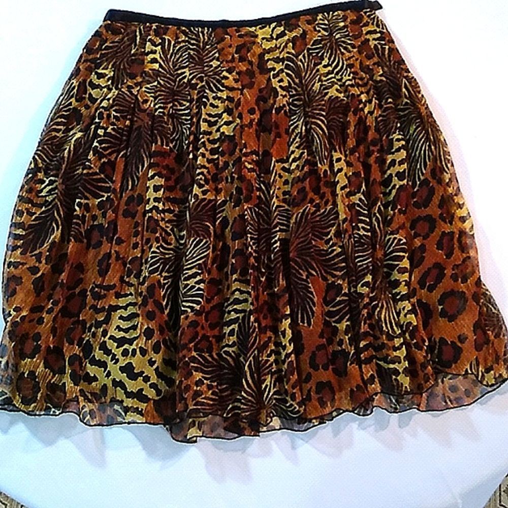 WD NY animal print skirt 100% silk lining is 100% polyester.